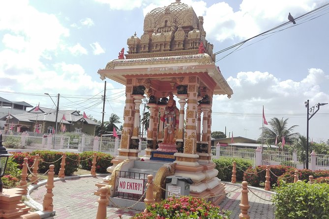 City Temple in the Sea Hanuman Murti Tour - Royal Botanic Gardens and Ariapita Avenue